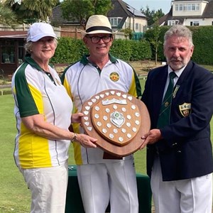 Ann Milne and Simon Powney accepting the Sidwell Mixed Pairs Shield from President Neil Fish
