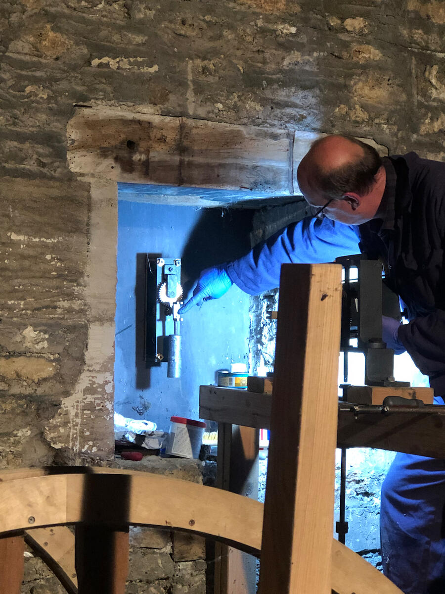 The clock was repaired in 2023. Here Simon Gilchrist, the specialist repairer, adjusts the dial from the inside of the tower.