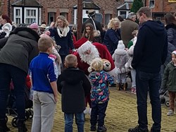 Father Christmas talking to children