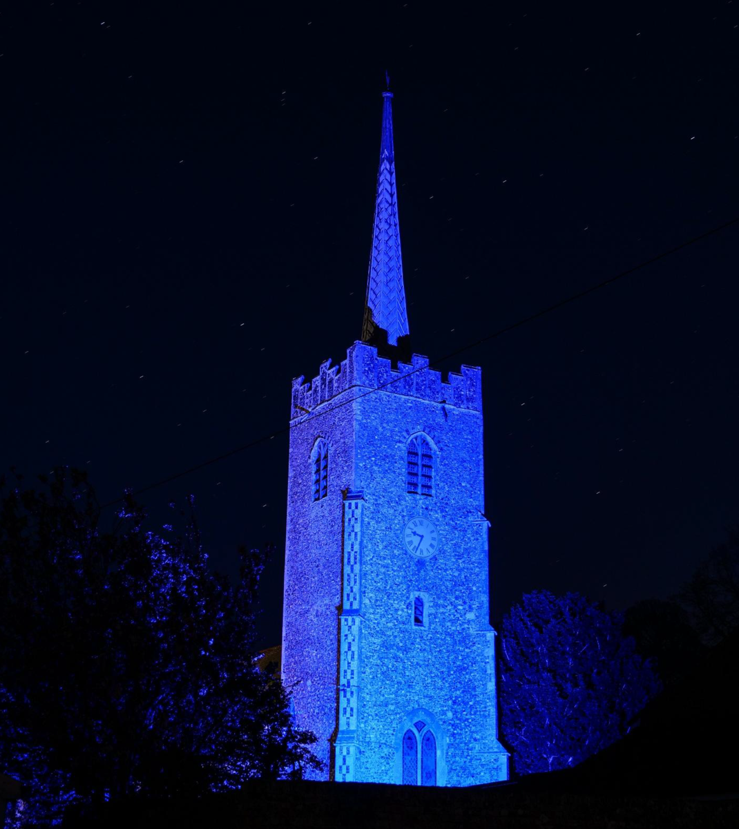 Church lit up to show the village's appreciation of NHS staff during the coronavirus pandemic.