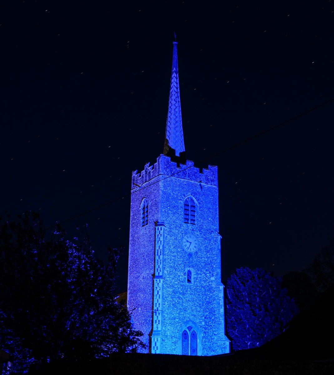 Church lit up to show the village's appreciation of NHS staff during the coronavirus pandemic. Church lit up to show the village's appreciation of NHS staff during the coronavirus pandemic.