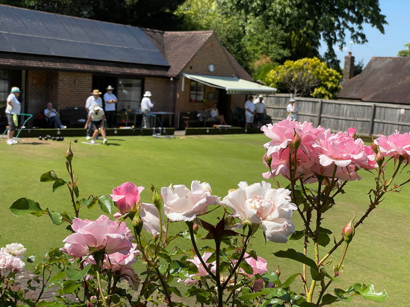 Members enjoy a game of bowls in the beautiful surroundings