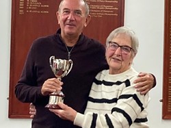 Winner of the Handicap competition, John Townley accepts the trophy from President Wendy Cross.
