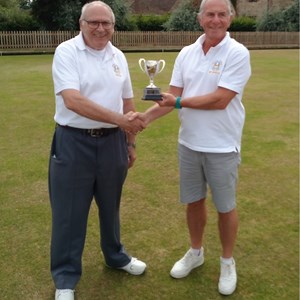 Novice cup winner Kevin Thomas receiving trophy from runner up Vaughn Dixon (on left)