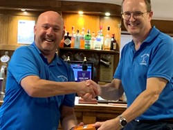 Tim presents the acting captain with the runner up sleeve of balls