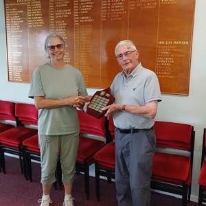 Men's, and winning Captain Roy Hosmer, receiving the annual trophy from Ladies Captain Liz Dyer