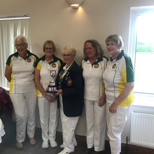 Jenny Turrell, Dawn Coulter, Carol McIldoon and Ann Milne accepting their Ladies S & D competition triples winners trophy at the recent luncheon S & D luncheon