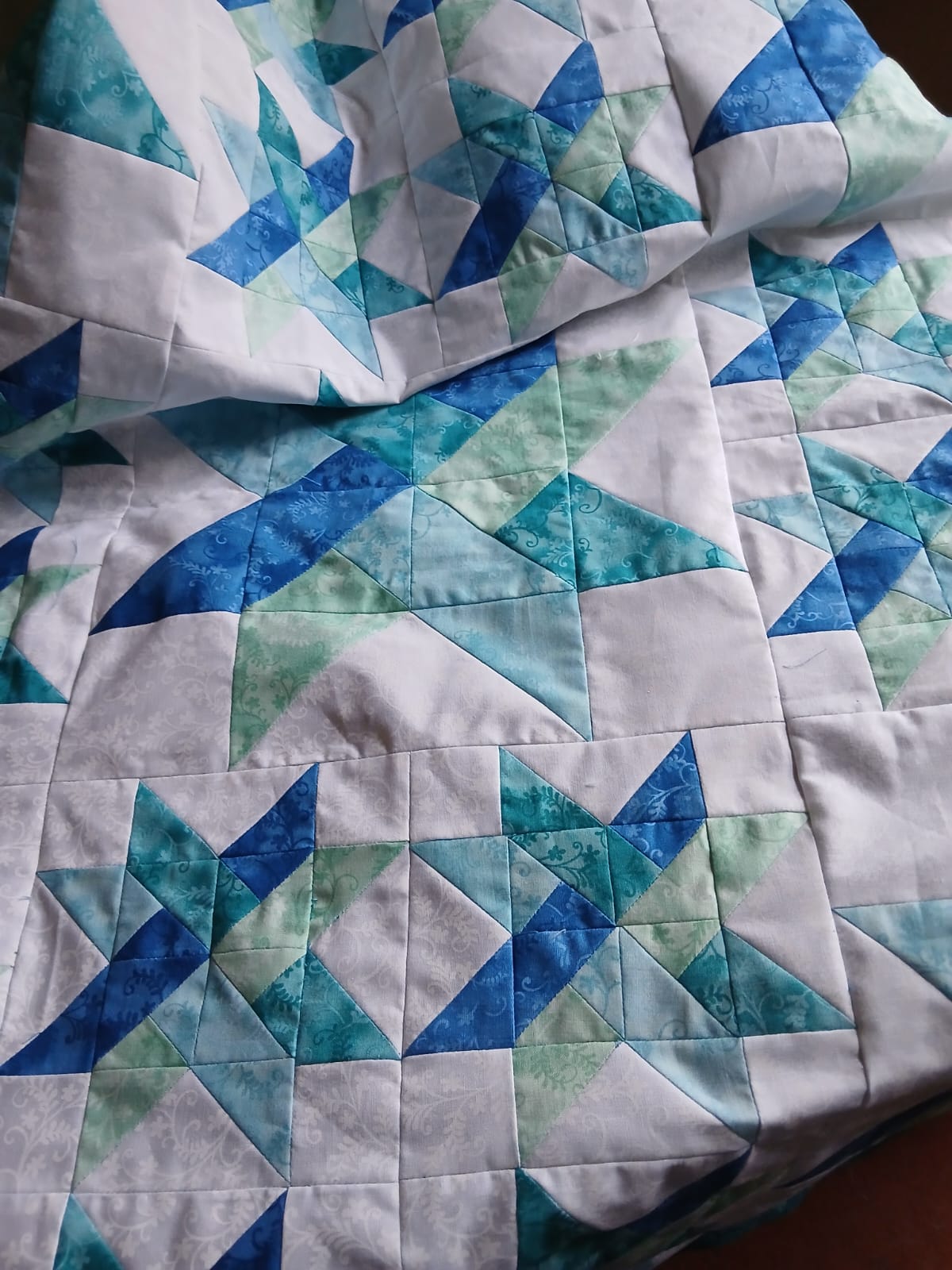 Quilt and pillow that were expertly made by Liz Hosmer, were won by Kevin Thomas - again.