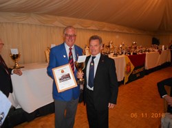Vice Captain Mike Rawle receiving our East 1 Division Winners Trophy from Bill Smith, Bowls England JVC at the County Lunch