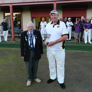 Brian Snell presents the Plympton Captain Ray Atrill with the cup.