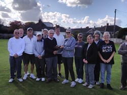 Roy receiving trophy from Liz after Men beat Ladies (just) in our annual match.