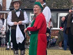 Cllr Tippen dressed as a Elf with morris dancers