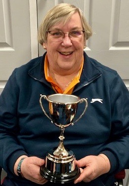 Secretary Nina Rawlins with the cup for the Secretary's Pairs competition.