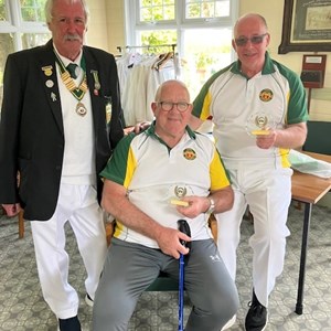 President Kelvin presenting Robin Moore & Clive Young with their runners up awards in the opening day 3 wood pairs competition