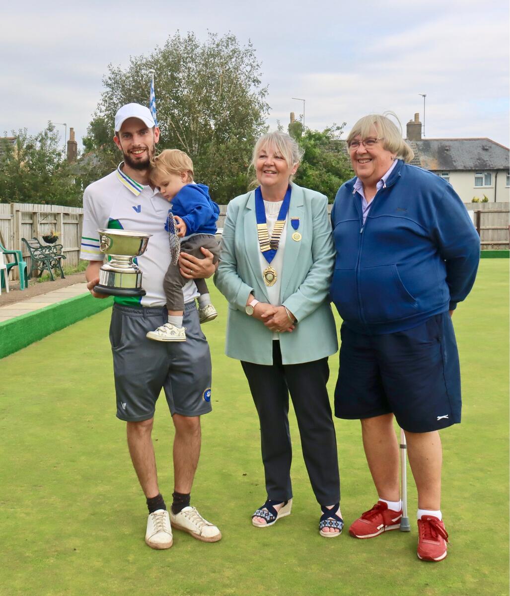 Stamford Town Crusaders' captain Jon Bailey with President Rita Downs and Secretary Nina Rawlins.