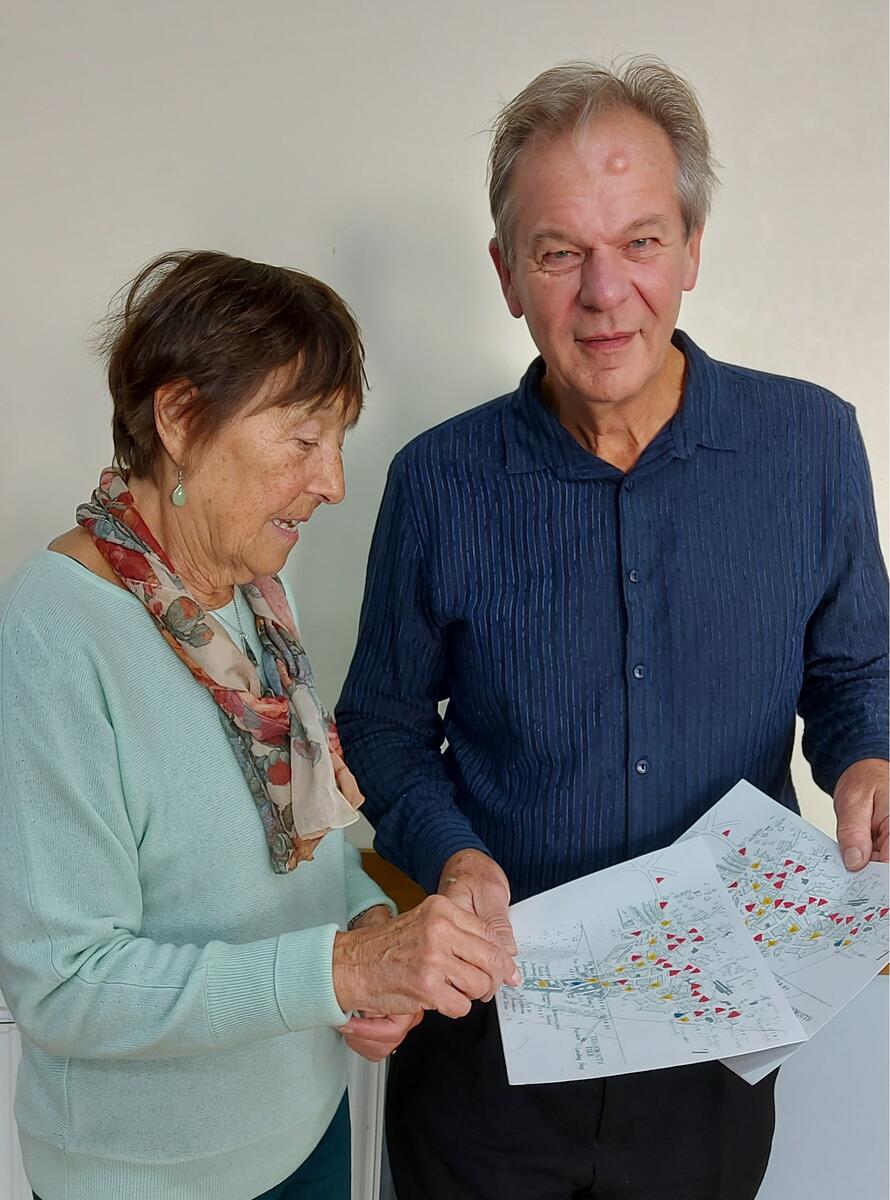 Pauline Dean showing our Speaker Finder, Terry Jackson the map of the Lost Pubs