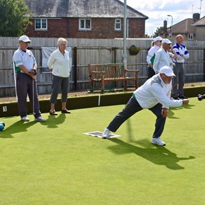 Bowlers in action.