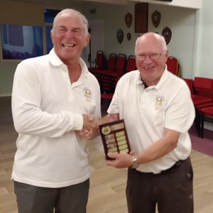 Kevin Thomas (on left) receiving Marko Team Shield on behalf of Tornadoes from Harriers captain Andy Williamson