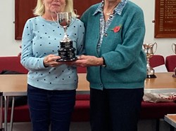 Sandra Gough collects the trophy for the Drawn Fours competition, on behalf of her team mates.