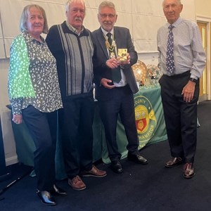 Carol & Kelvin Mcildoon along with Robert Rymill receiving their Southampton & District Centenary Cup runners up trophies. Missing is Pat McClure