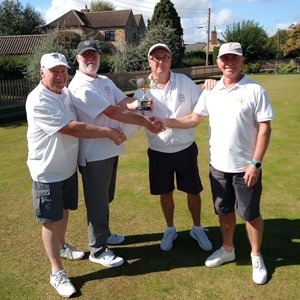 Drawn Pairs runners up Jim Findlay & Mick Swannell (on left) presenting trophy to winners Richard Lambert & Kevin Thomas