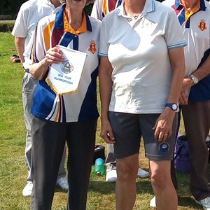 Liz handing over a pennant to South Cliff