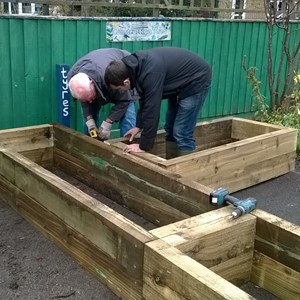 Building raised flowerbed for school