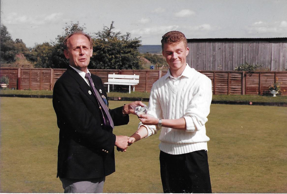 Chris Marron receiving his trophy from George Pawlett