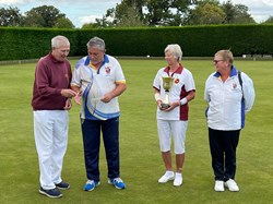 Ted presents the money