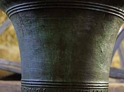 Close-up of a bell and the inscription cast around it