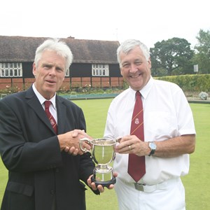 Two woods: Chairman Chris Beale presenting the cup to Ken Scott