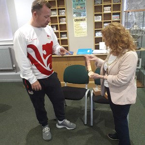 David showing his medal to Daventry Town Council Mayor Lynne Taylor at Daventry Museum