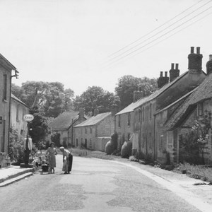 High Street note Esso sign ontop of fuel pump.also open ditch has been filled in.
