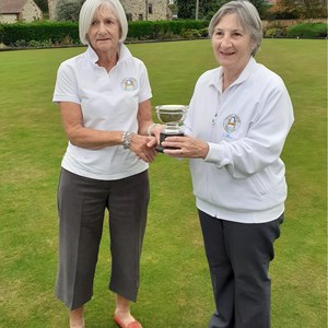 Ladies Club Champion Colleen Laker on right receiving trophy from Runner Up Jenny Owen