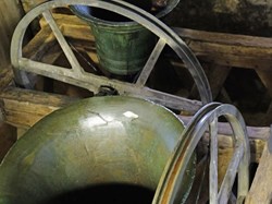 A bell and its wheel in the frame