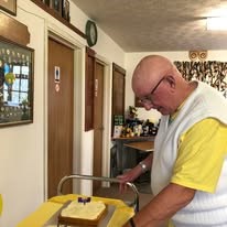 President Peter cutting cake