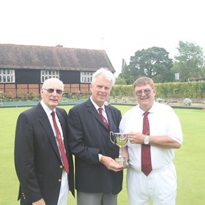 100 up: Chairman Chris Beale presenting the cup to David Barnes and Paul Brown
