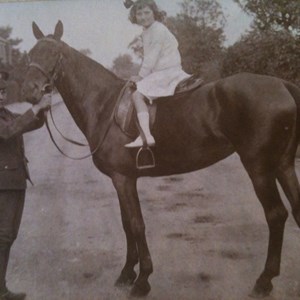Elodie being treated to a horse ride, Station Road c 1915