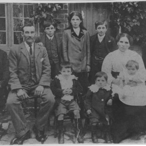 Ewers, Gerald (killed in Second World War), Moses, Sid, Lil, Mark, Matilda (mother), Bob.  Front: Eli, Len, Christie (on lap), outside 2 Crown Cottages