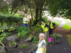 Weeding the long border