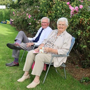 Stamford League Chairman Charlie Underwood spectating with his wife.