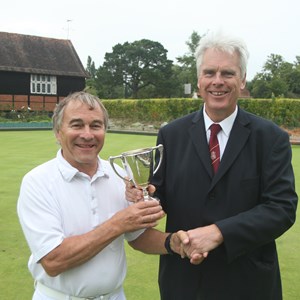 Junior singles: Chairman Chris Beale presenting the cup to Peter Cannon