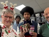 Handing out the socks that have been filled with needed items and a few christmas goodies