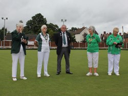 President Alan Guest hands over the green to Ladies president Joyce Lamb