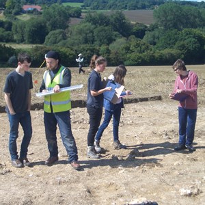 Jez instructing volunteers in trench recording