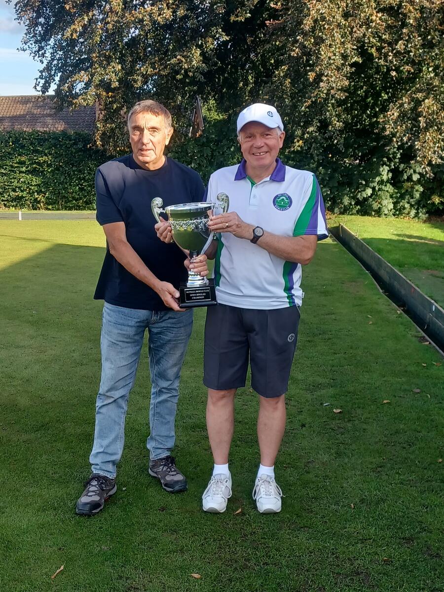 Winner Rob Ellison presented with the trophy by Nigel