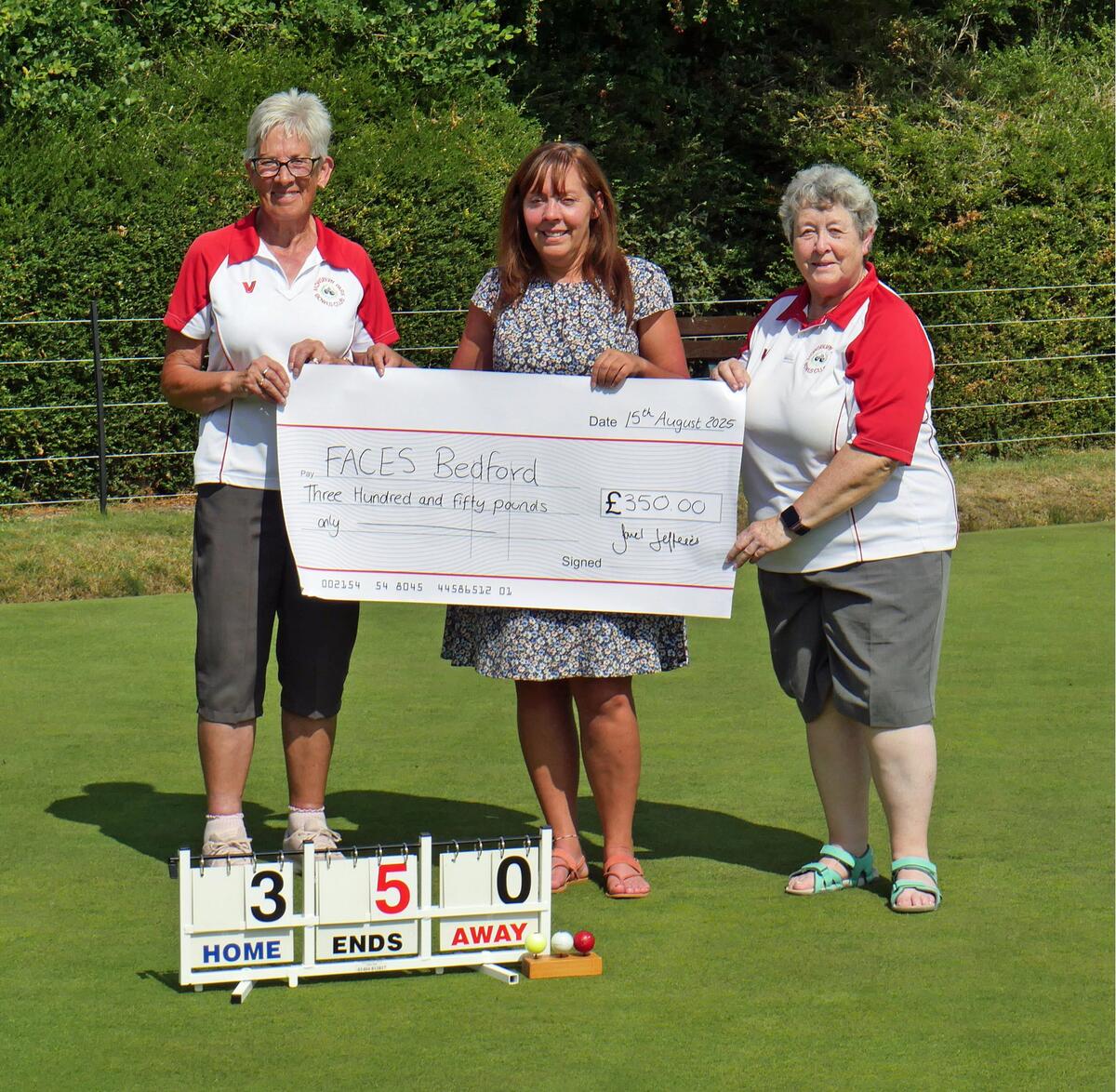 Michaela receiving  our cheque