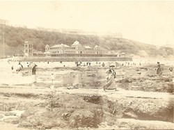 Exploring rock pools with the Spa behind.