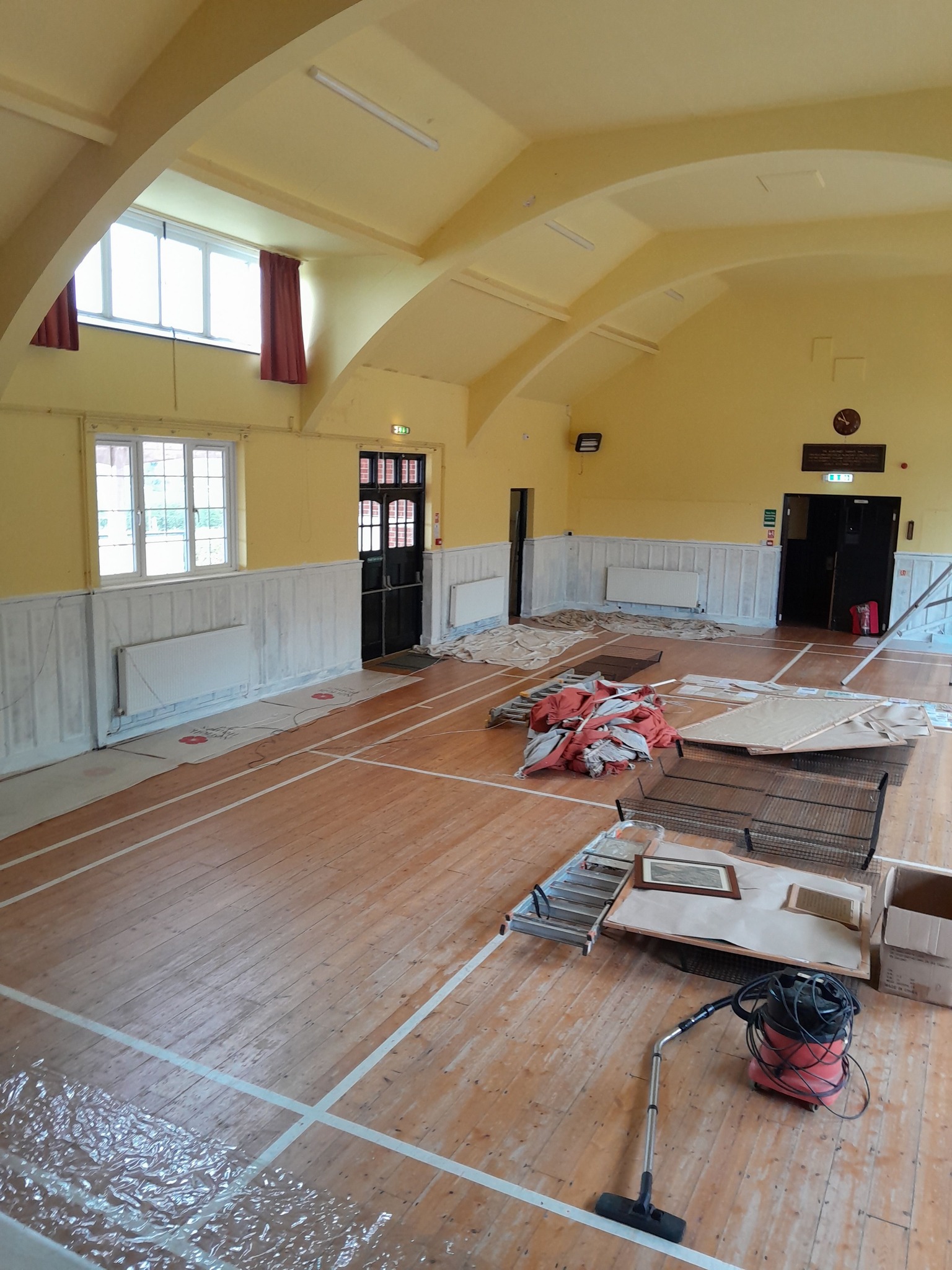 Hall with woowork primed ready for soft sage green paint. Curtains taken down ready for new linings.