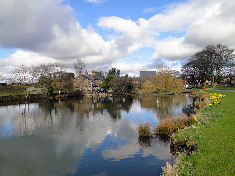 View of Grewelthorpe Pond in Springtime
